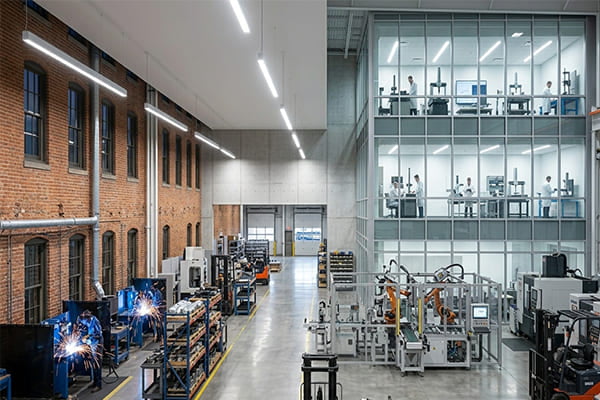 A bright industrial warehouse lit with 5000K cool white light